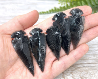Black Obsidian Arrowheads in hand