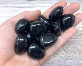 Black Obsidian Tumbled Crystals in hand