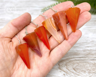 Carnelian Pendulums in hand