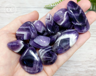 Chevron Amethyst Tumbled Crystals in hand