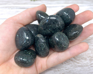 Galaxyite Large Tumbled Crystals in hand