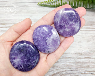 Lepidolite Palm Stones in hand