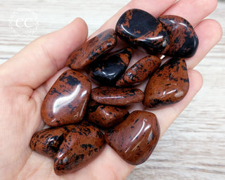 Mahogany Obsidian Tumbled Crystals in hand
