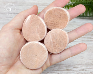 Peach Moonstone Dragon Eggs in hand
