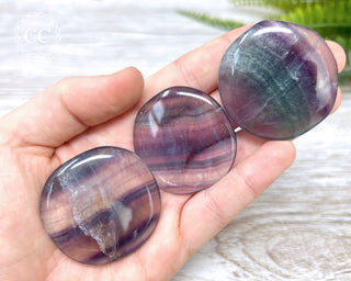 Rainbow Fluorite Palm Stones in hand