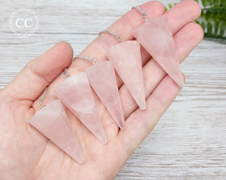 Rose Quartz Pendulums in hand