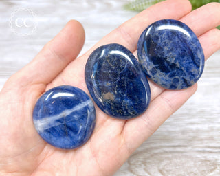 Sodalite Palm Stones in hand