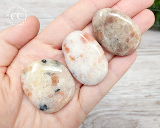Sunstone Palm Stones in hand