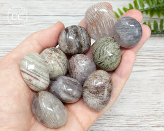 Thousand Layer Quartz Tumbled Crystals in hand
