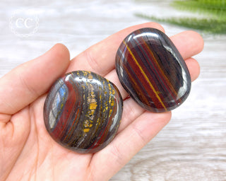 Tiger Iron Palm Stones in hand