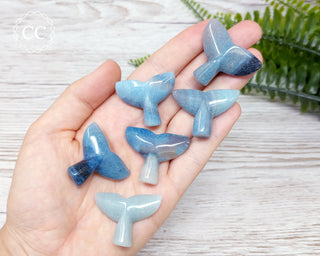 Trolleite Whale Tail carvings in hand
