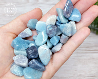 Small Trolleite tumbled crystal in hand