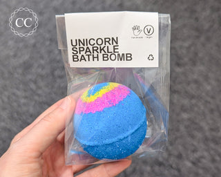 Unicorn Sparkle Bath Bomb in hand