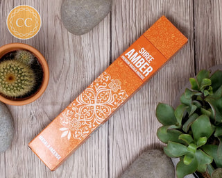 Shree Amber Incense sticks on wooden background