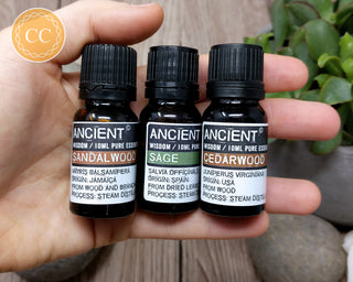 Essential Oils for Meditation - Sandalwood, Cedarwood & Sage in hand