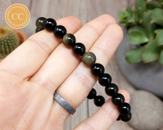 Gold Sheen Obsidian 8mm Beaded Bracelet in hand