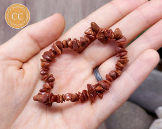 Goldstone gemchip bracelet in hand