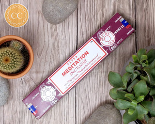 Satya Meditation Incense sticks on wooden background