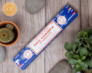 Satya Nag Champa Incense sticks on wooden background