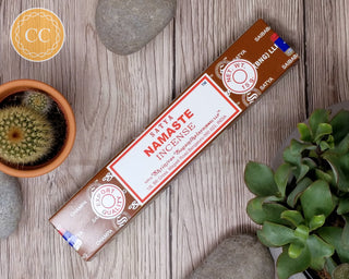 Satya Namaste Incense sticks on wooden background