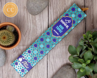 Noor Oud Topaz incense Sticks on wooden background