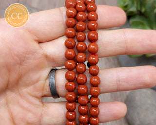 Red Jasper 6mm Beaded Bracelet in hand