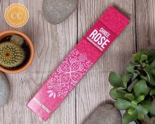 Shree Rose Incense sticks on wooden background