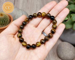 Tiger's Eye 8mm Beaded Bracelet in hand