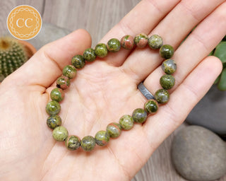 Unakite 8mm Beaded Bracelet in hand