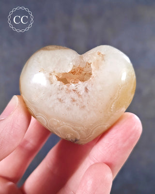 A hand holding an Agate Heart from Madagascar
