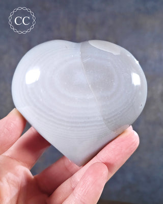 A hand Holding an Agate Heart from Madagascar