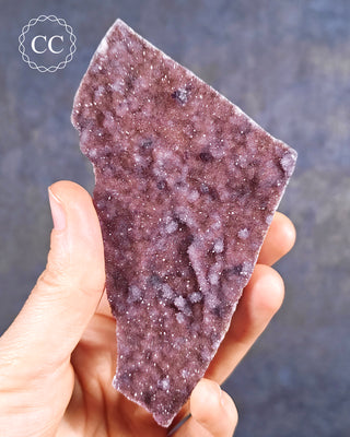 Alacam Amethyst Cluster from the Alacam mine in Turkey, show held in a hand.