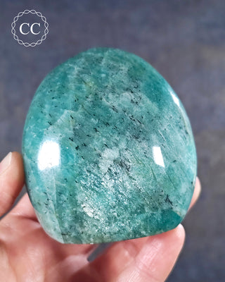A hand holding an Amazonite Freeform from Madagascar