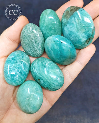 Amazonite Mini Palm Stones in hand