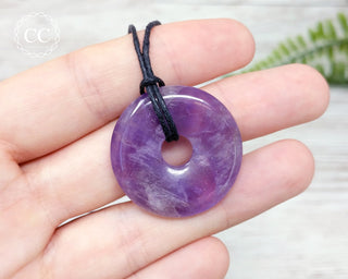 Amethyst Donut Necklace in hand