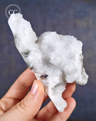 Aurora Quartz, aka Iris Quartz, Anandalite or Rainbow Quartz. Shown held in the hand.