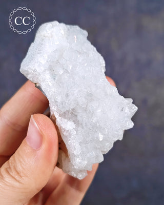 Aurora Quartz, aka Iris Quartz, Anandalite or Rainbow Quartz. Shown held in the hand.