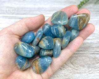 Aquatine Lemurian Calcite Tumbled Crystals in hand
