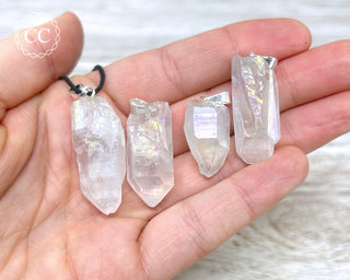 Angel Aura Quartz Necklaces in hand