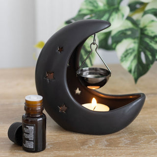 Black Crescent Moon Oil Burner on wooden table