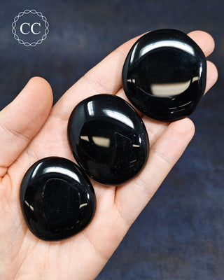 Black Obsidian Palm Stones in hand
