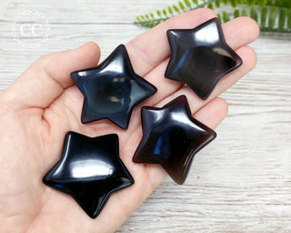 Black Obsidian Stars in hand