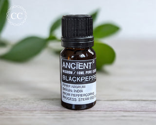 Black Pepper Essential Oil on table