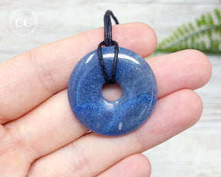 Blue Aventurine Donut Necklace in hand