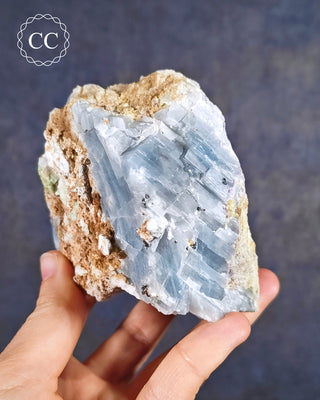 Blue Calcite with Graphite Specimen from Namibia in hand