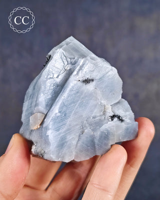 Blue Calcite with Graphite Specimen from Namibia in hand