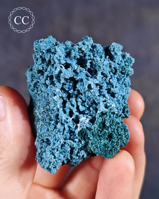 Blue Chalcedony specimen from Aurangabad, India shown in a hand