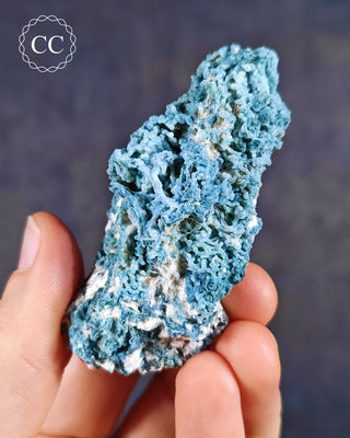 Blue Chalcedony specimen from Aurangabad, India shown in a hand