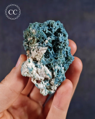 Blue Chalcedony specimen from Aurangabad, India shown in a hand
