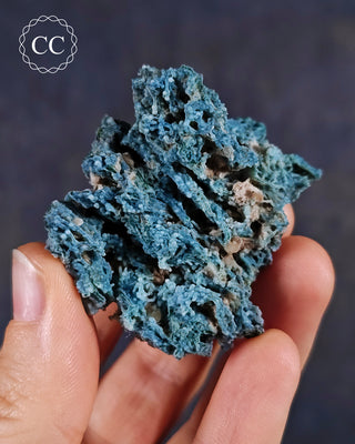 Blue Chalcedony specimen from Aurangabad, India shown in a hand